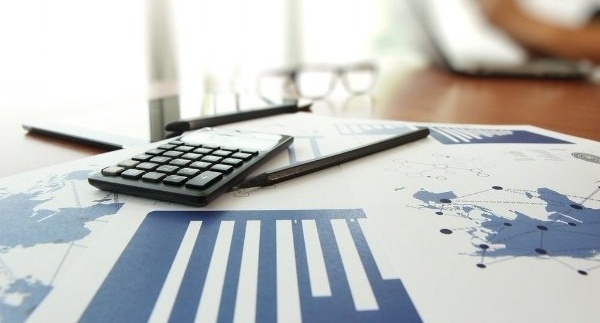 business documents on office table with calculator and digital tablet and man working in the background-657738-edited-706893-edited.jpeg business documents on office table with calculator and digital tablet and man working in the background-657738-edited-706893-edited.jpeg